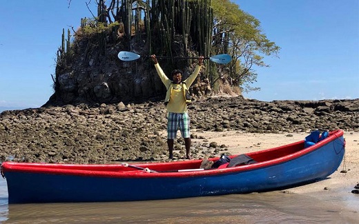 Eddy next to a canoe on the Paquera beach on the way to Montezuma, Santa Teresa